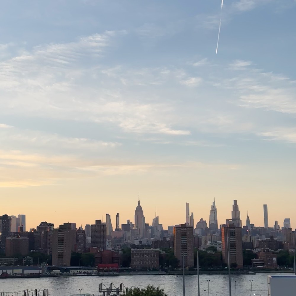 New York City skyline at dusk, viewed across the water